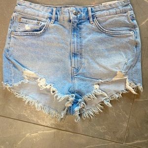 Light blue jean shorts.